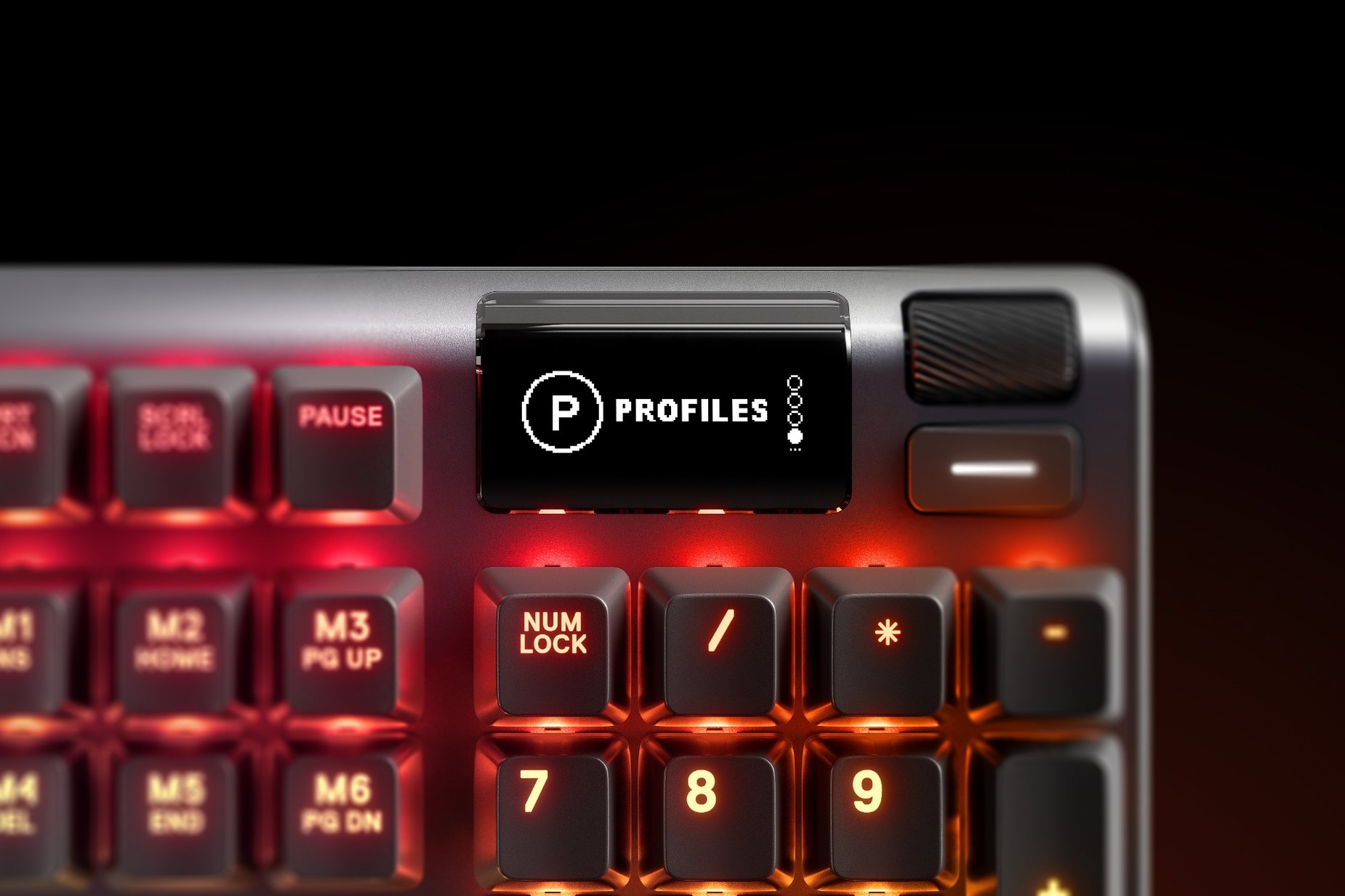 
 Zoomed in view of the multimedia and settings controls/volume roller on the German - Apex Pro gaming keyboard
 