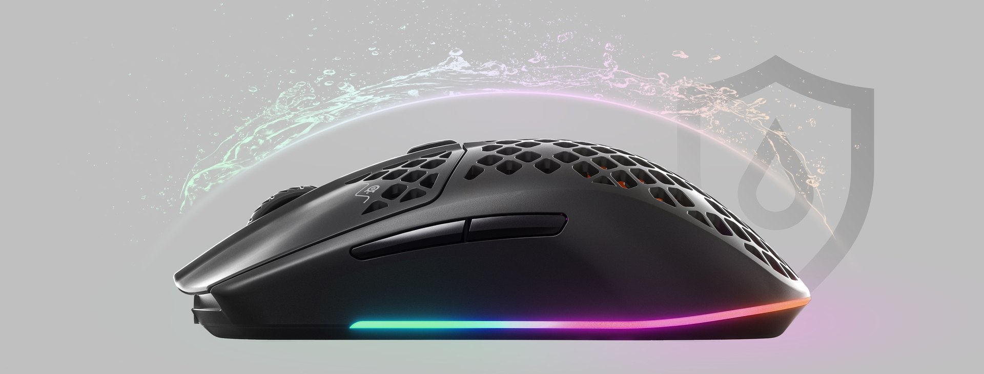 An Aerox 3 Wireless mouse with an invisible shield protecting it from incoming water splashing, to convey the waterproofing features.
